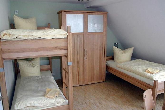 Gruppenhaus hier Dreibettzimmer mit eigenem Bad