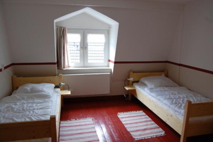 Doppelzimmer mit Holzboden